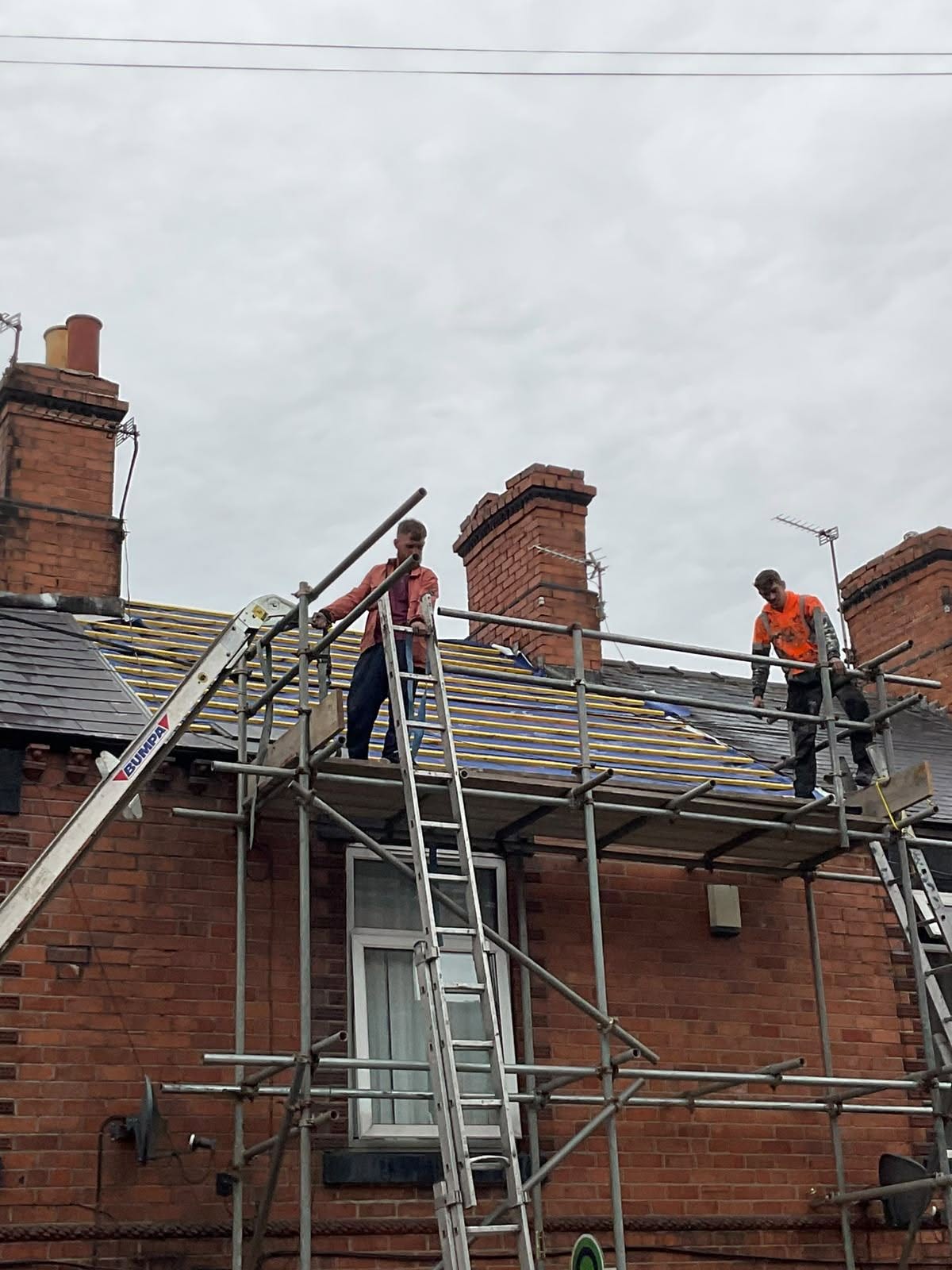 Total Roofing and Repairs Limited team working on a roofing project
