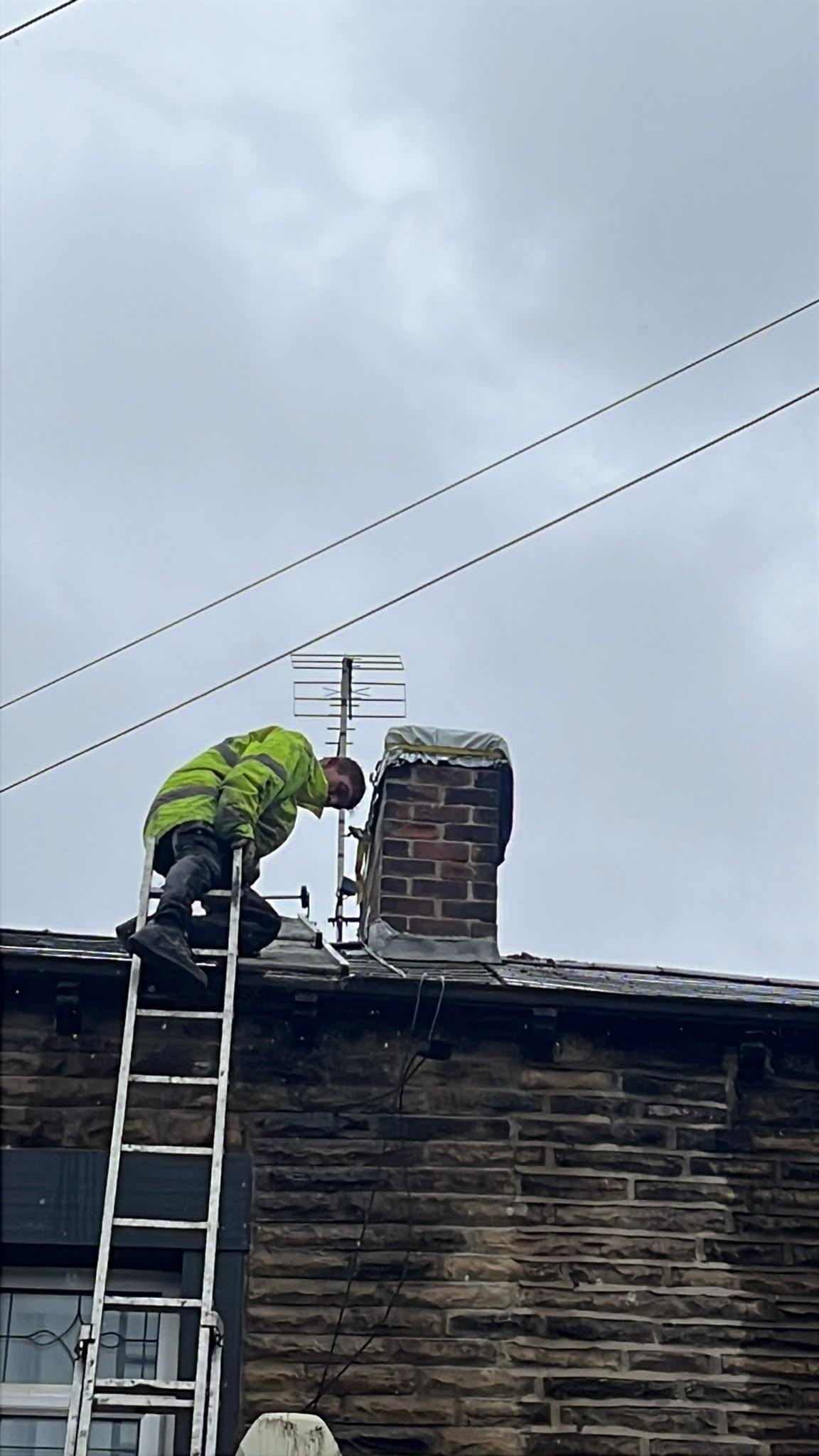 Chimney showing deteriorated pointing and roofing details