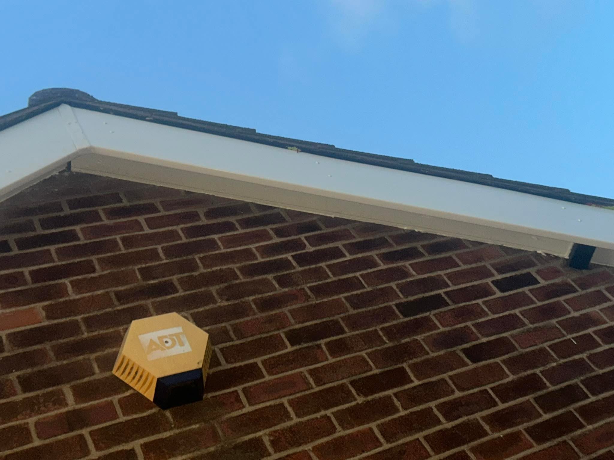 Close view showing fascia and soffit beneath a roof edge