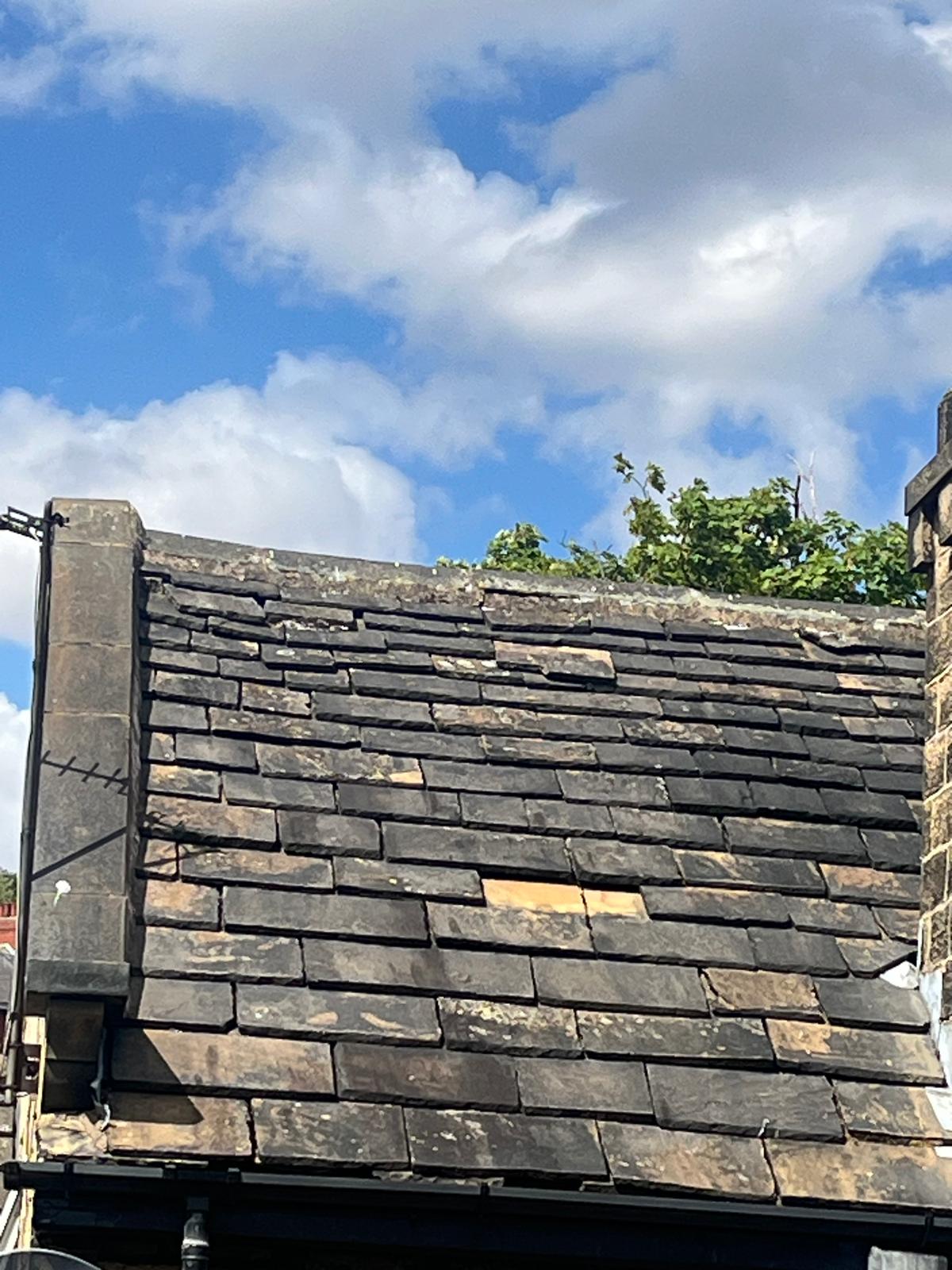 Roof showing widespread deterioration requiring assessment for replacement